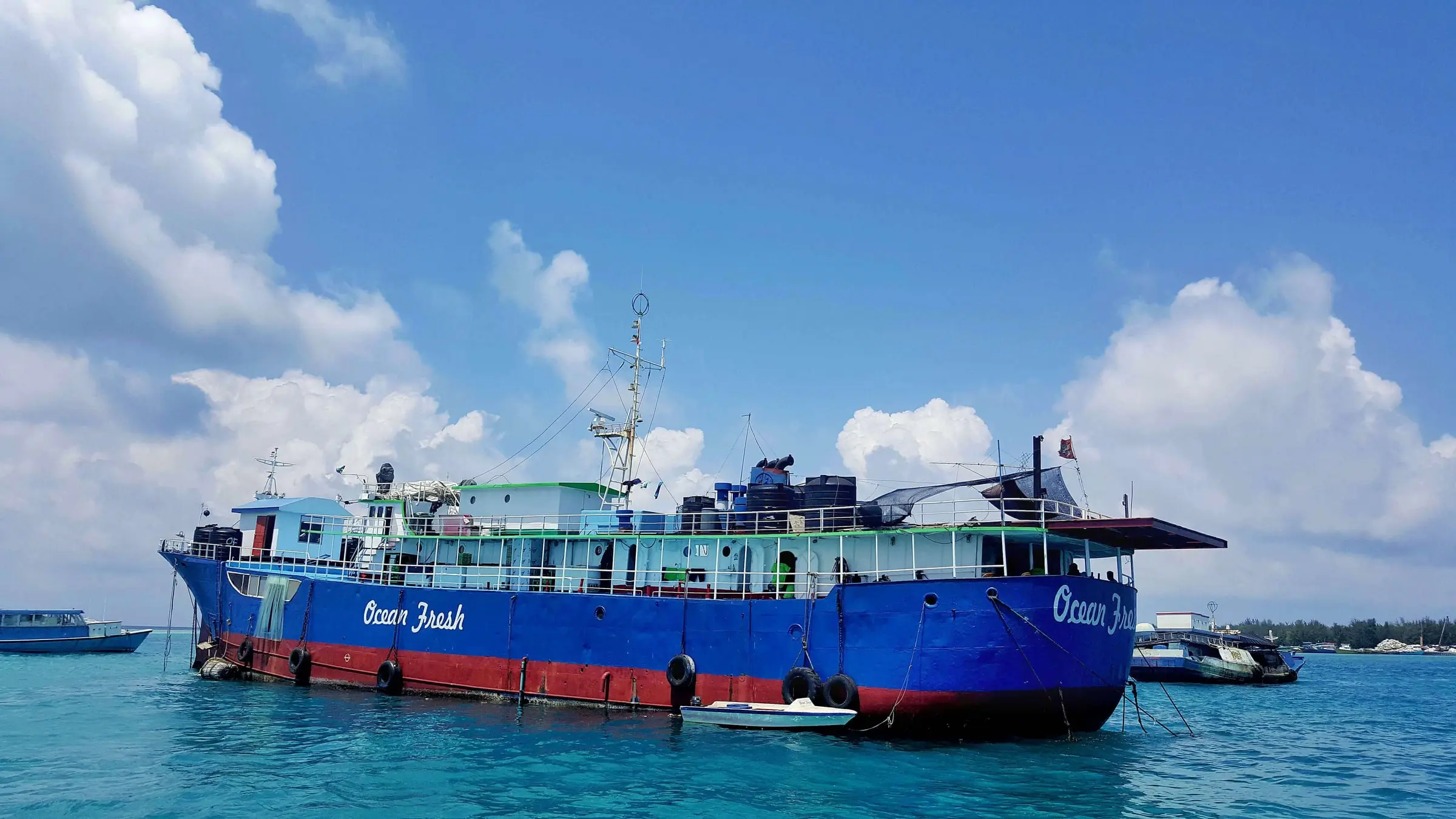 An Ocean Fresh vessel moored in turquoise Maldivian water